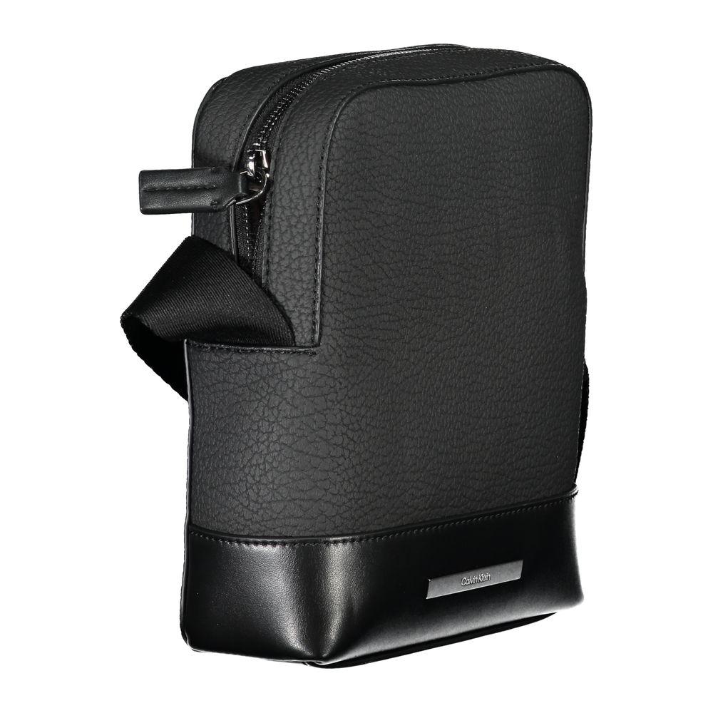 Calvin Klein sleek black shoulder bag with contrasting details, adjustable strap, and external pocket.
