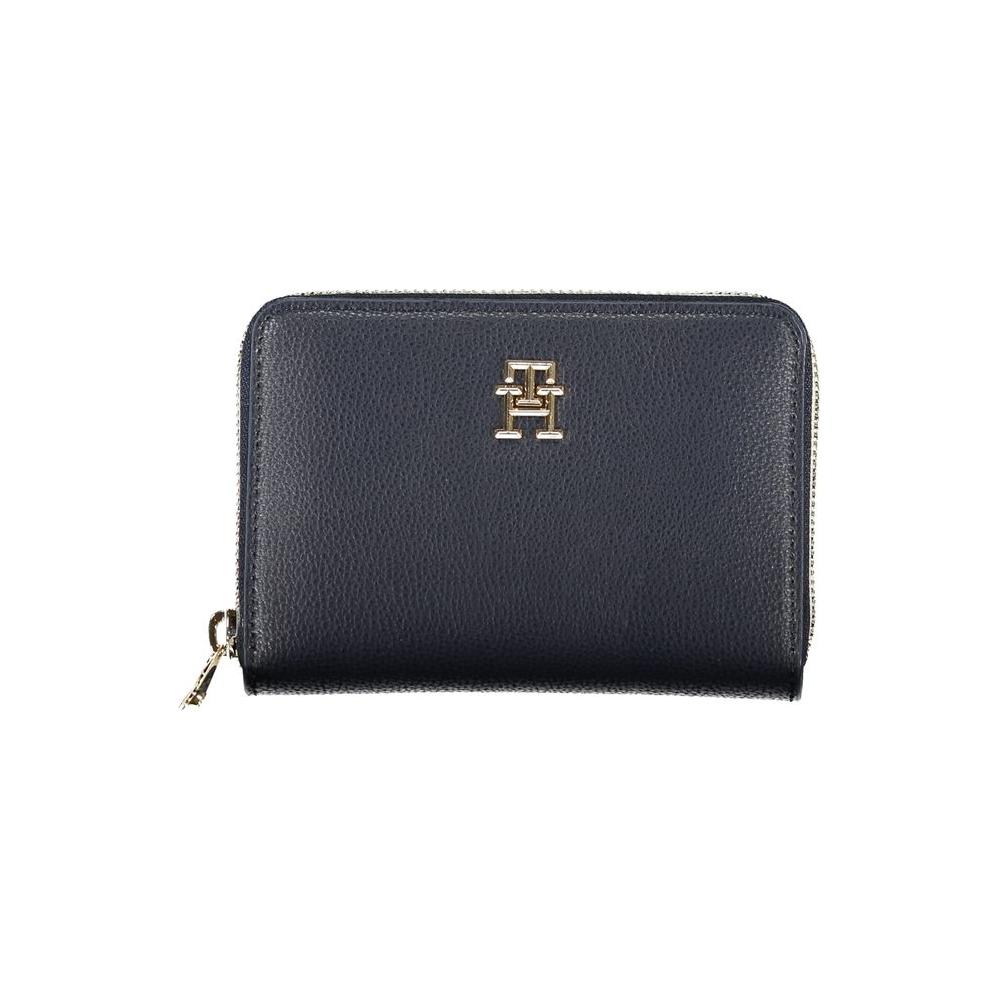 Tommy Hilfiger sleek blue wallet with zip closure and signature logo, offering style and organization in eco-friendly materials.
