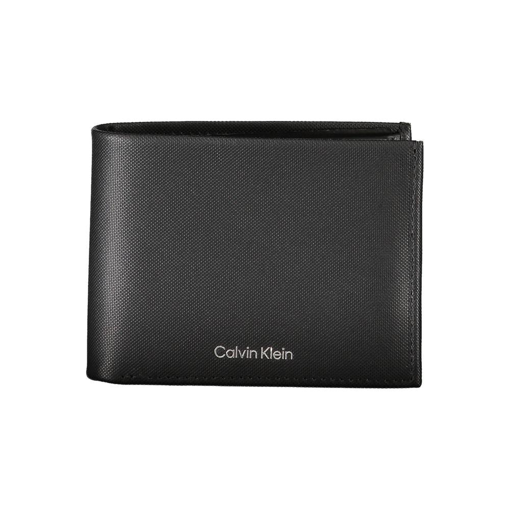 Calvin Klein black leather wallet with RFID blocking, featuring compartments for currency, coin purse, card spaces, and logo detailing.