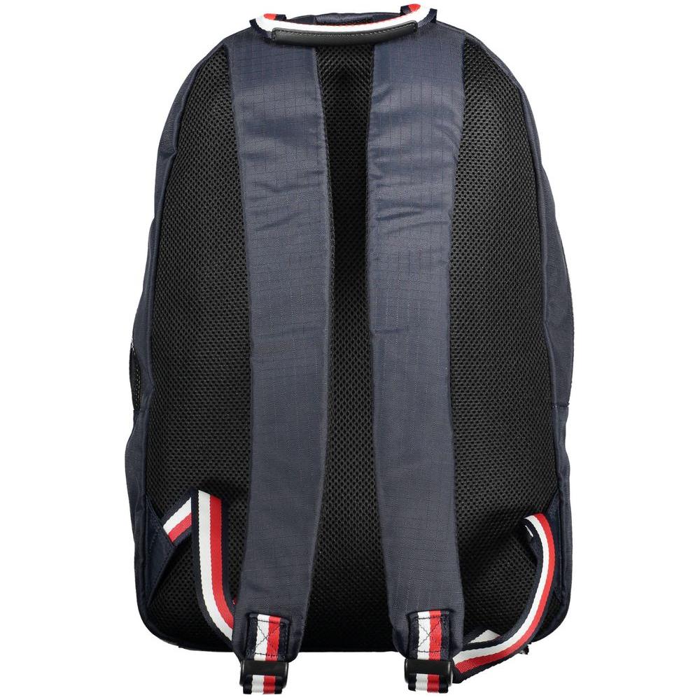 Back view of Tommy Hilfiger blue polyester men's backpack with adjustable straps and red, white detailing.