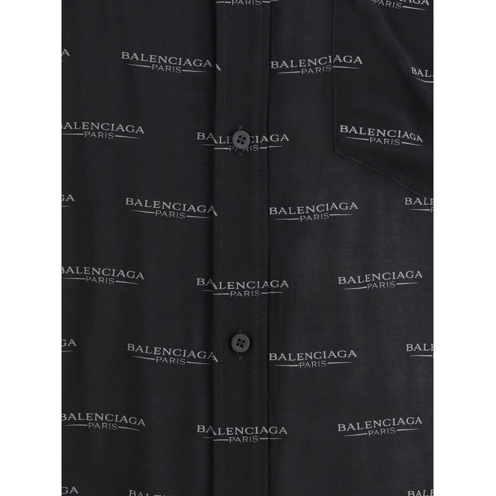 Close-up of Balenciaga Logoed Shirt with all-over monogram design, classic collar, button closure, and adjustable cuffs for a modern look.