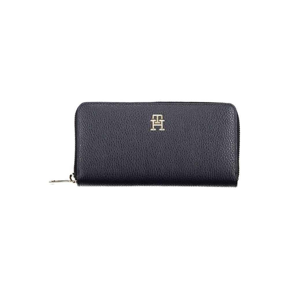 Tommy Hilfiger blue polyethylene women's wallet with zip closure and logo, features 5 compartments, including coin purse.