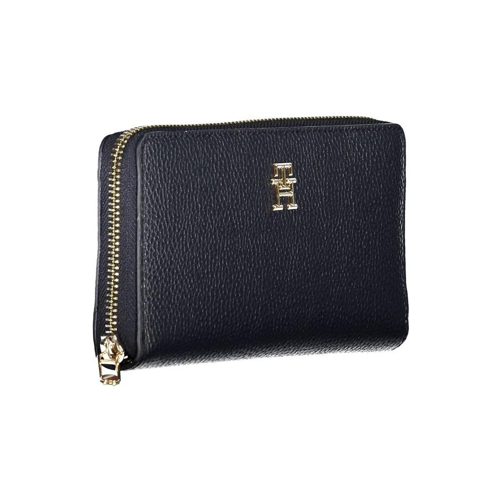 Tommy Hilfiger blue women's wallet with zip closure, multiple compartments, and logo.