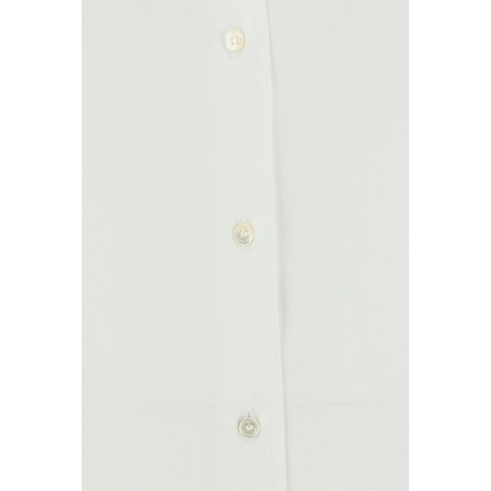 Close-up of F.IT shirt with monochrome pattern, button closure, and adjustable cuffs, showcasing classic style in an oversize fit.