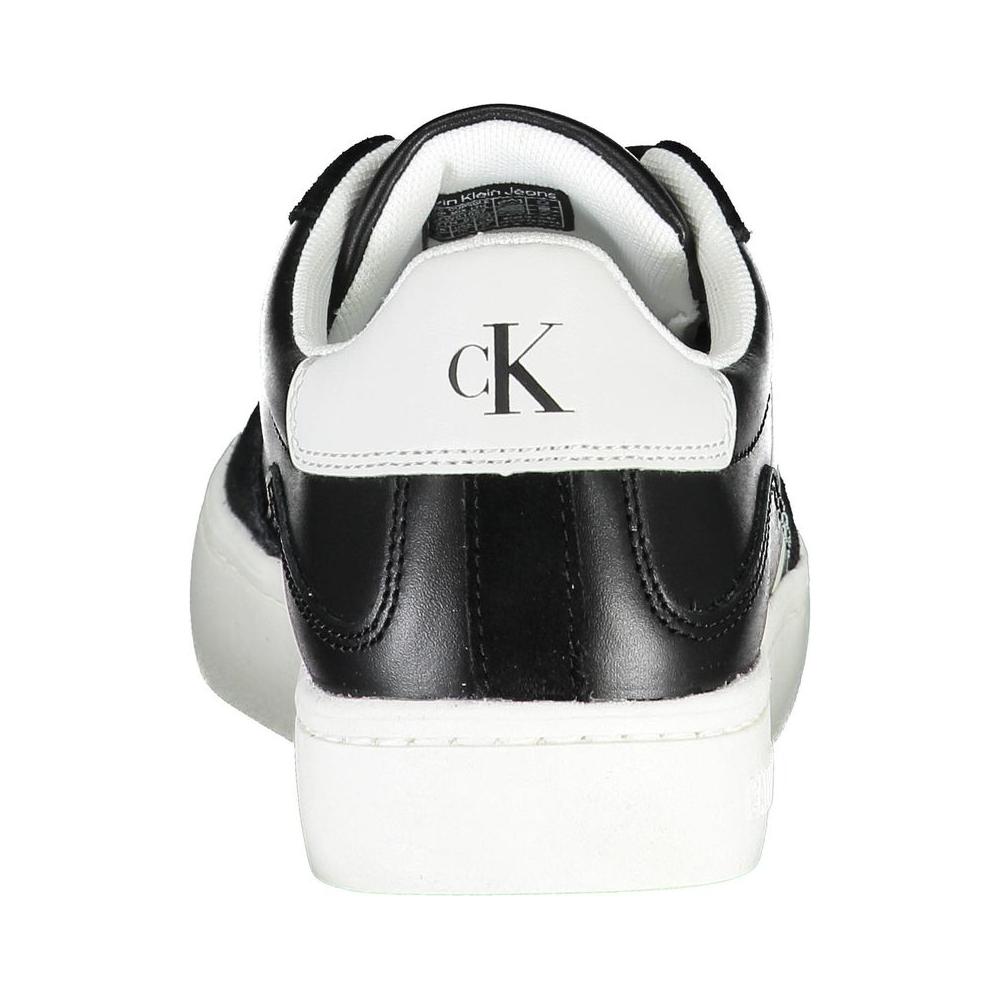 Back view of Calvin Klein black sneakers with contrast white details and logo.
