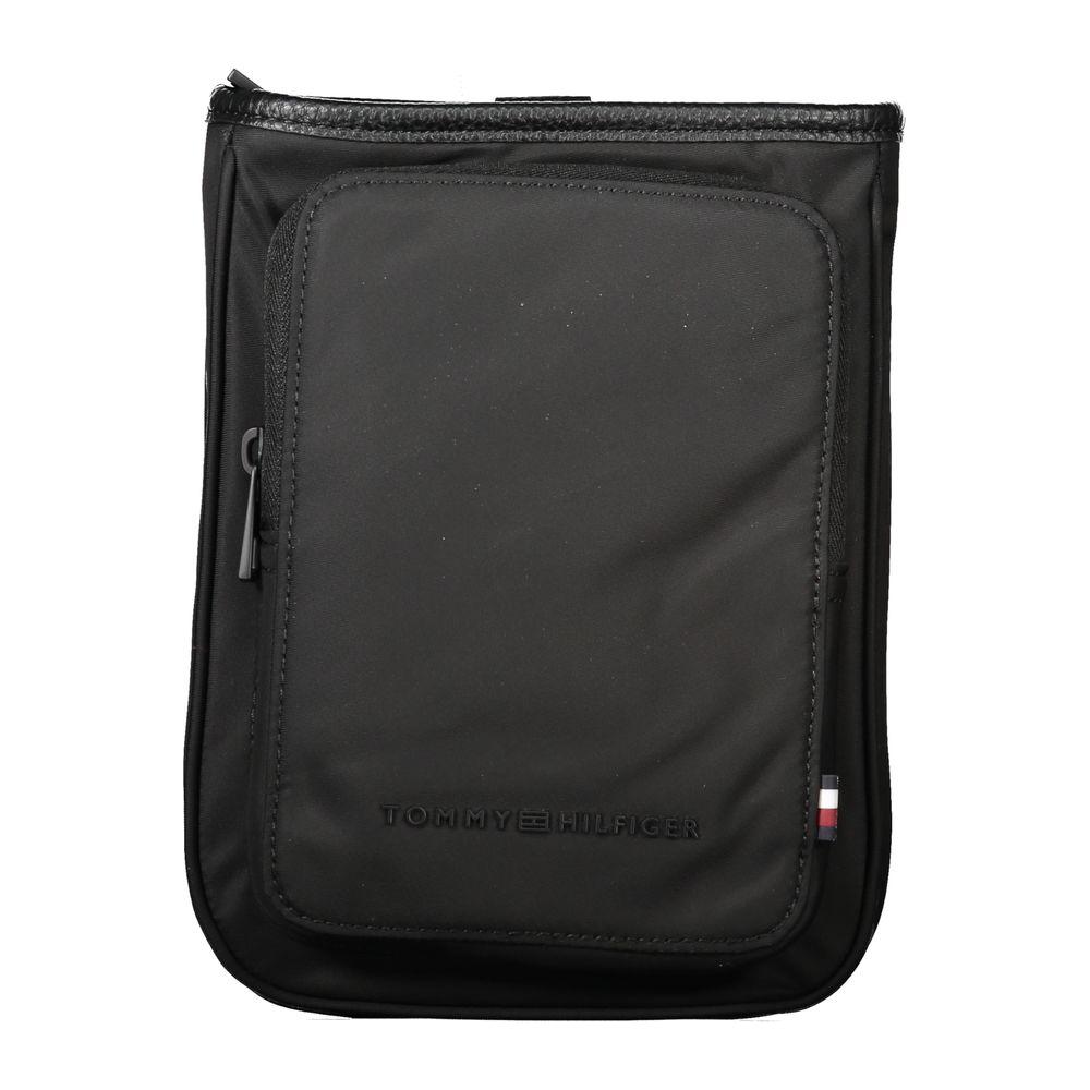 Tommy Hilfiger black polyester men's shoulder bag with adjustable strap, external pocket, and signature logo.