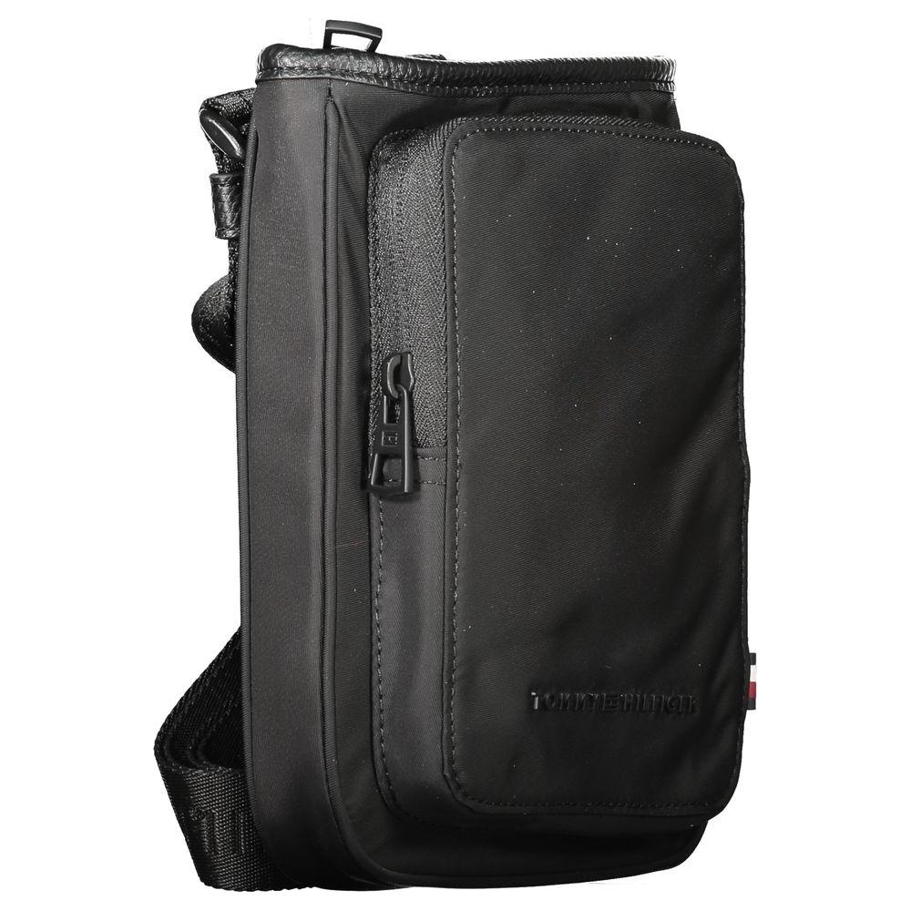 Tommy Hilfiger black polyester men's shoulder bag with adjustable strap and logo, made for urban style and practical use.