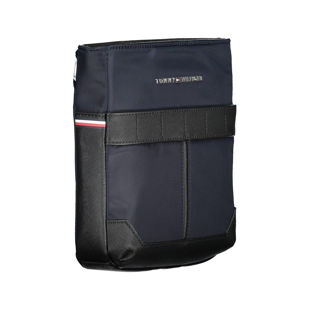 Tommy Hilfiger blue polyester men's shoulder bag with adjustable strap and logo emblem, featuring two external pockets.