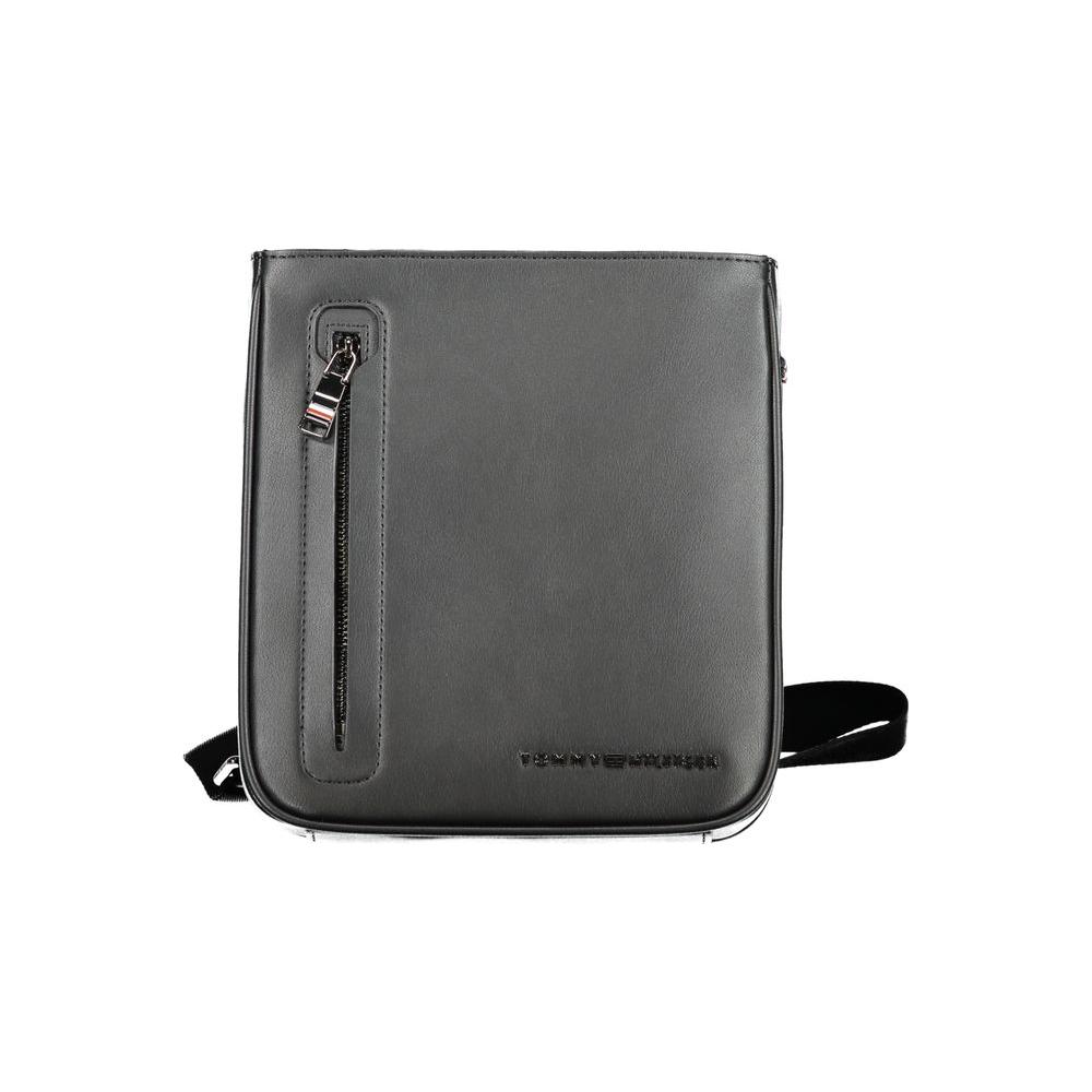 Tommy Hilfiger black polyethylene shoulder bag with adjustable strap, external and internal pockets, and zip closure with logo.