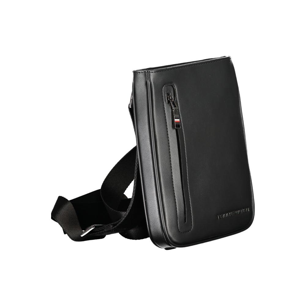 Tommy Hilfiger black polyethylene shoulder bag with adjustable strap, external and internal pockets, and zip closure showcasing logo.