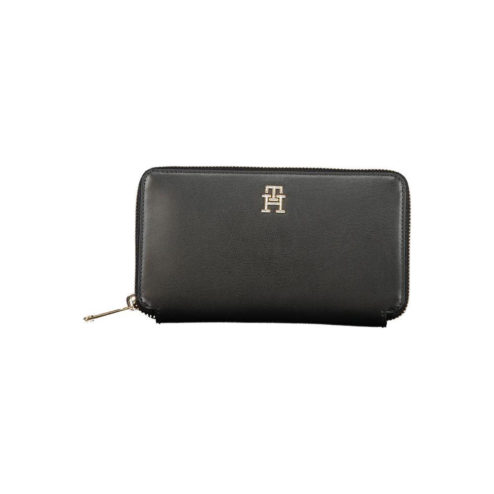 Tommy Hilfiger black polyethylene wallet with 4 compartments, coin purse, card slots, zip closure, and logo design