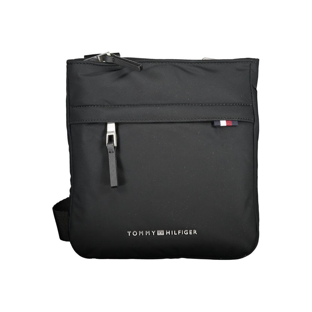 Tommy Hilfiger black polyester shoulder bag with adjustable strap, external and internal pockets, zip closure, and logo.