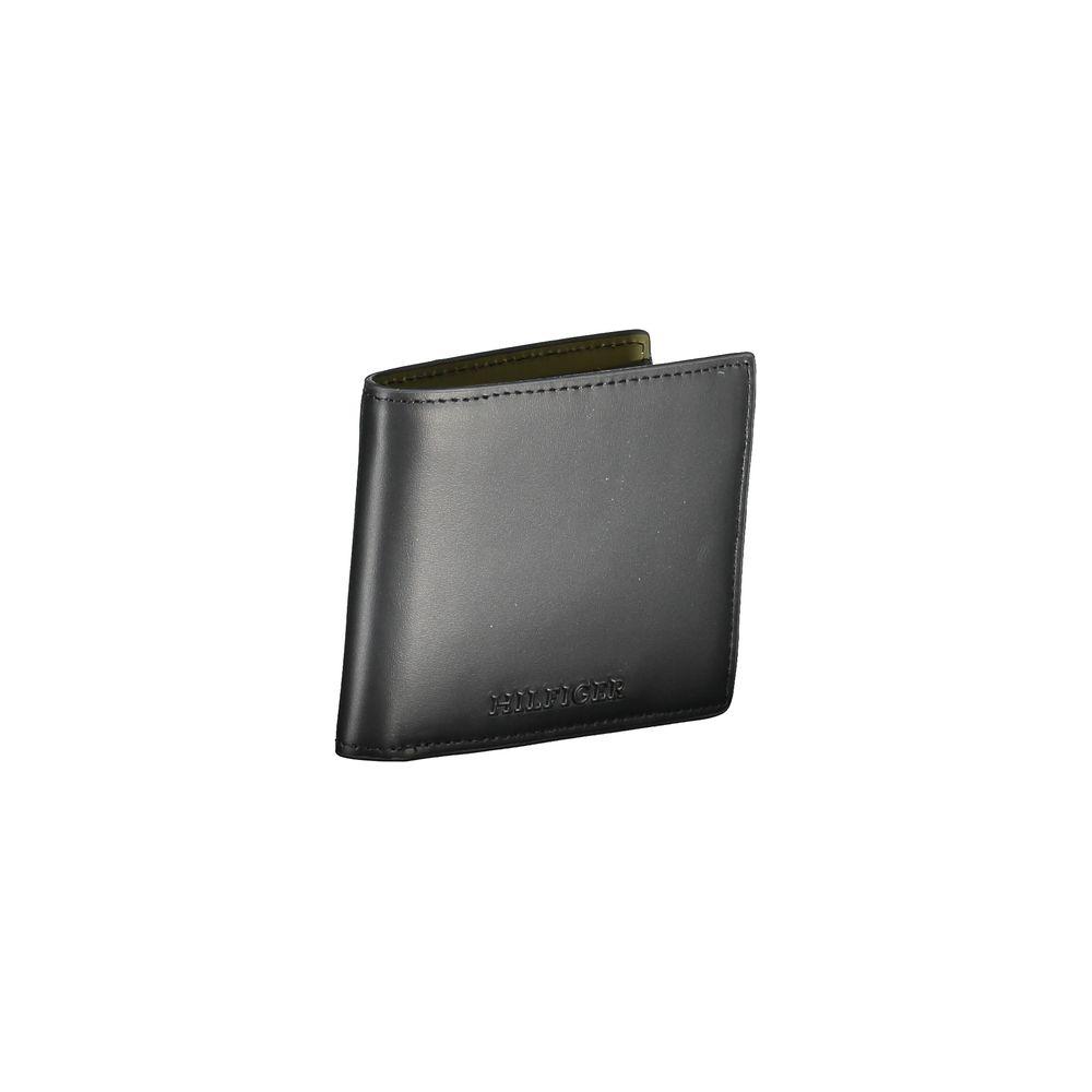 Tommy Hilfiger black leather wallet with double card spaces, contrasting details, and embossed logo print.