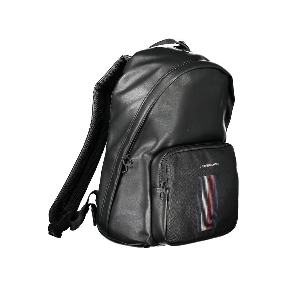 Tommy Hilfiger black polyester backpack with adjustable straps, external pocket, and laptop compartment.