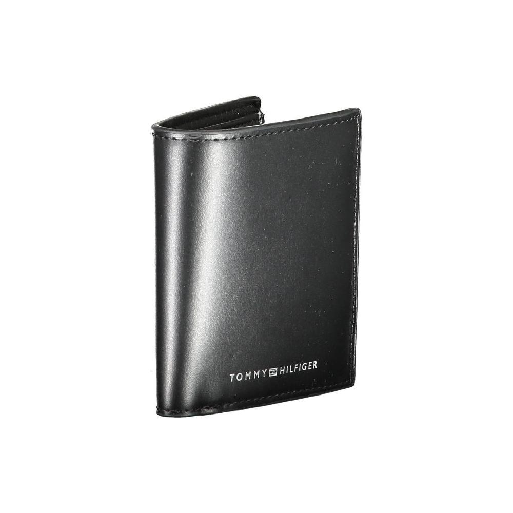 Tommy Hilfiger black leather men's wallet with logo, featuring compartments for cash, cards, and coin purse.