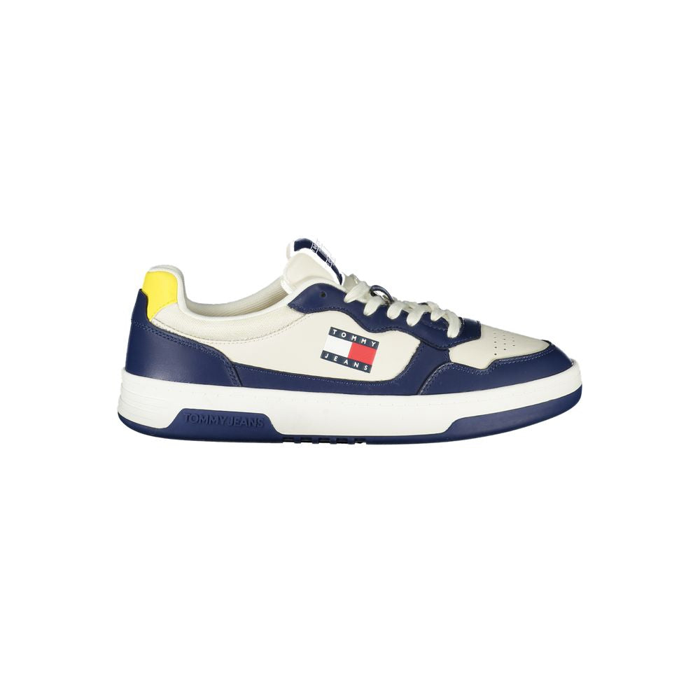 Tommy Hilfiger blue sneaker with white and yellow accents, featuring logo and removable insole for comfort.
