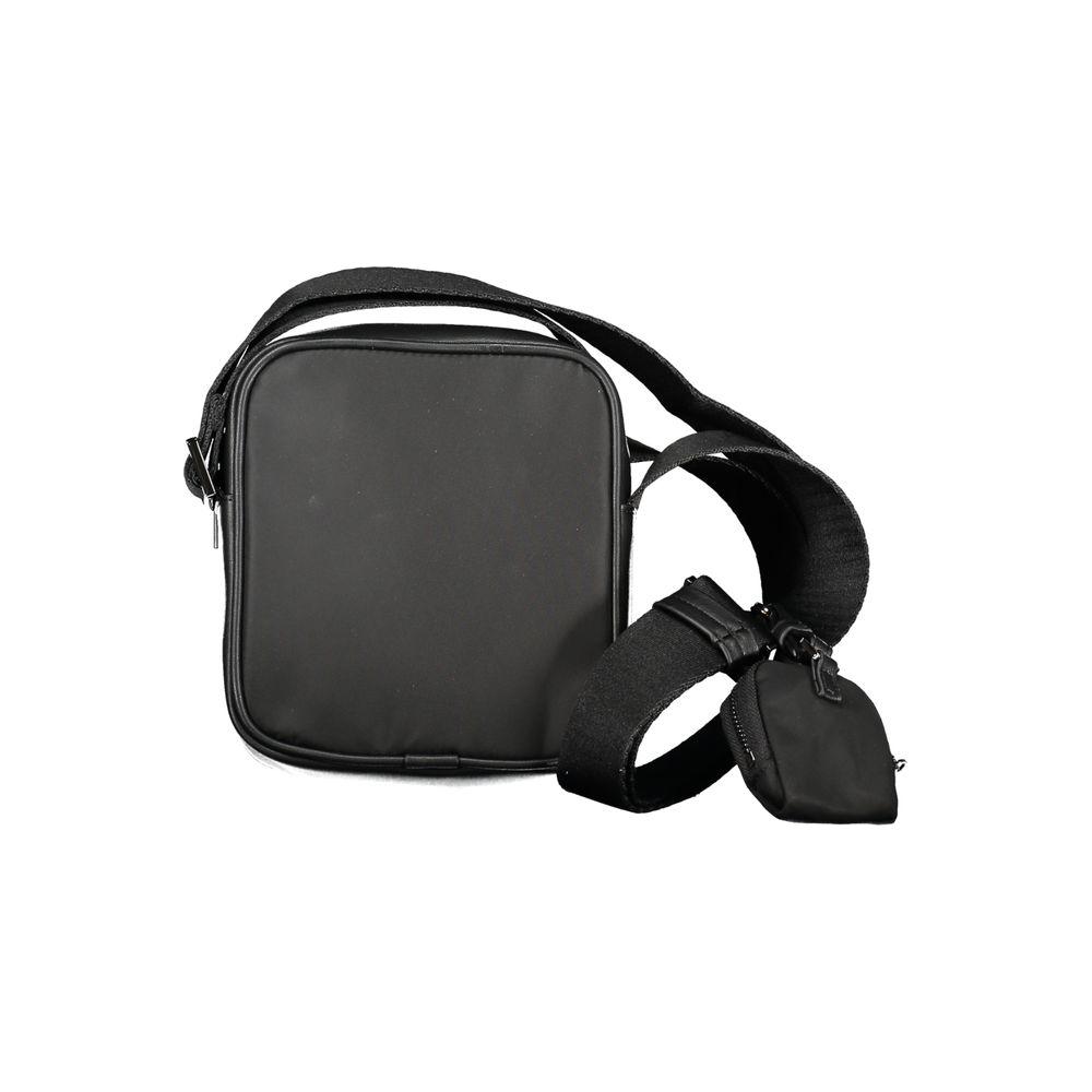 Calvin Klein black polyester shoulder bag with adjustable strap, internal pocket, zip closure, and removable coin purse.