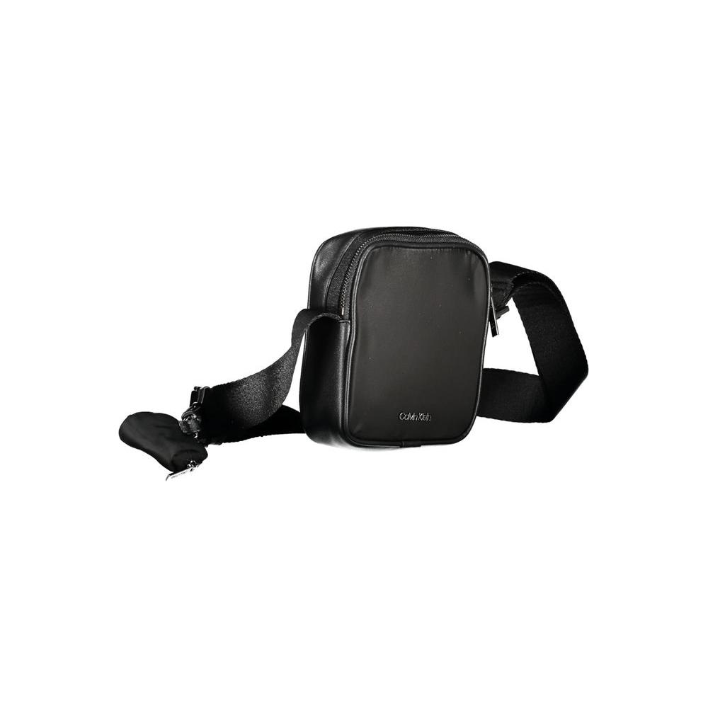 Calvin Klein black shoulder bag with adjustable strap, zip closure, and removable coin purse, made from recycled polyester.