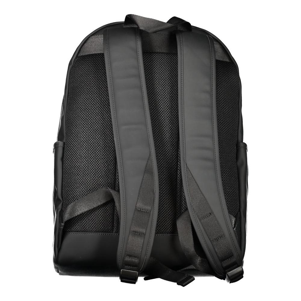 Back view of Tommy Hilfiger black backpack with adjustable shoulder straps and mesh detailing.