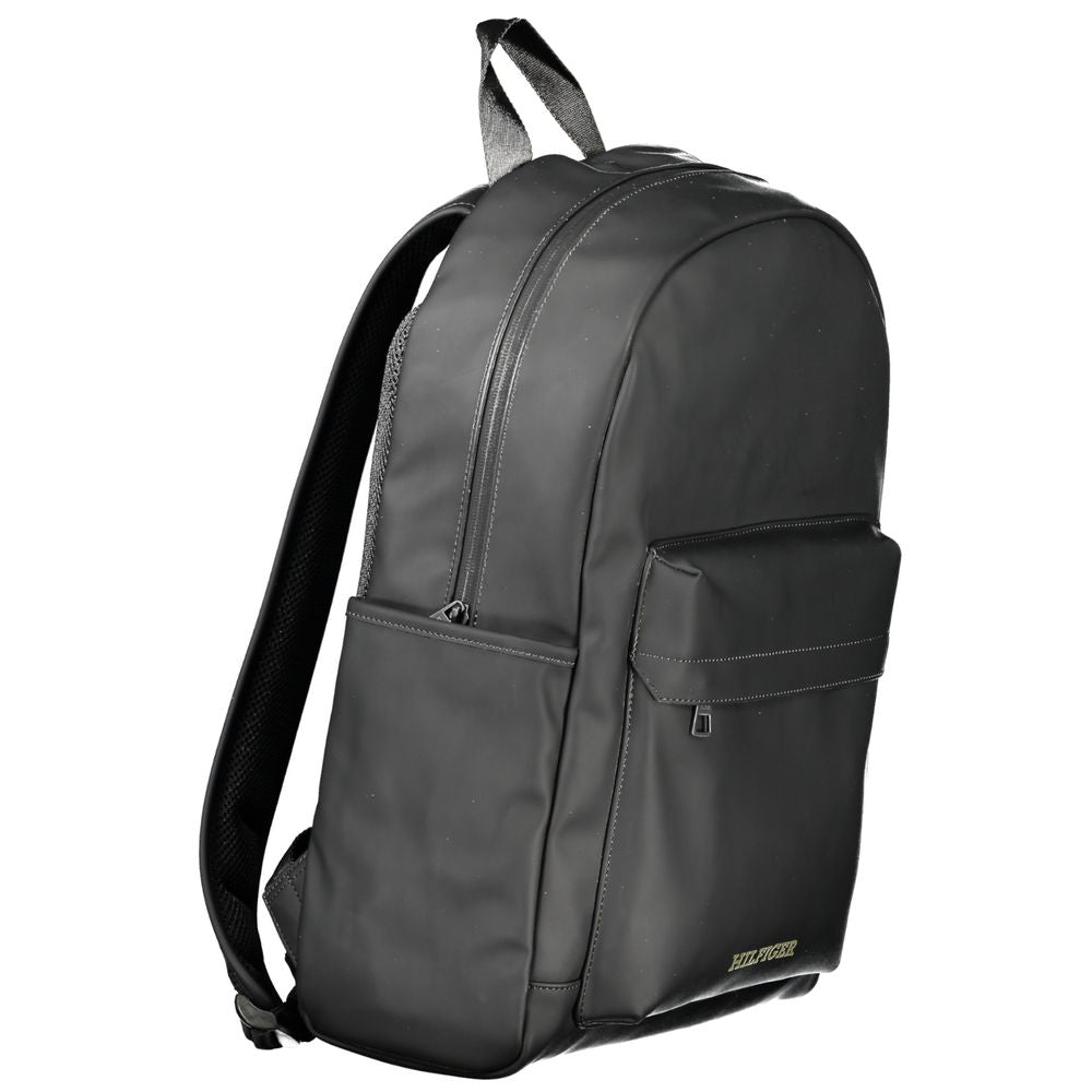 Tommy Hilfiger black polyester backpack with handle, adjustable straps, external pockets, and laptop compartment.