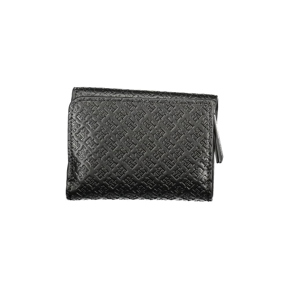 Tommy Hilfiger black wallet for women made of polyethylene, featuring an embossed design, dual card compartments, and zip closure.