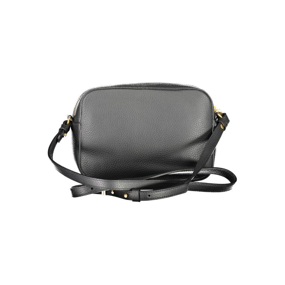 Coccinelle black leather women's handbag with adjustable strap and external pocket, featuring a secure zip and magnetic snap closure.