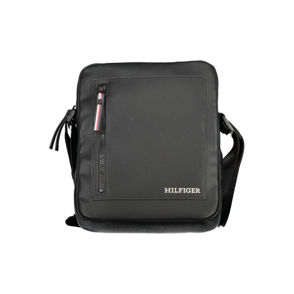 Tommy Hilfiger black polyethylene shoulder bag with adjustable strap, zip closure, and pockets for iPad and accessories.