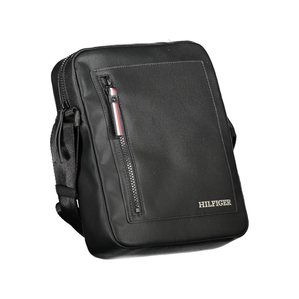 Tommy Hilfiger black polyethylene shoulder bag with adjustable strap, zip closure, external and internal pockets, and logo.