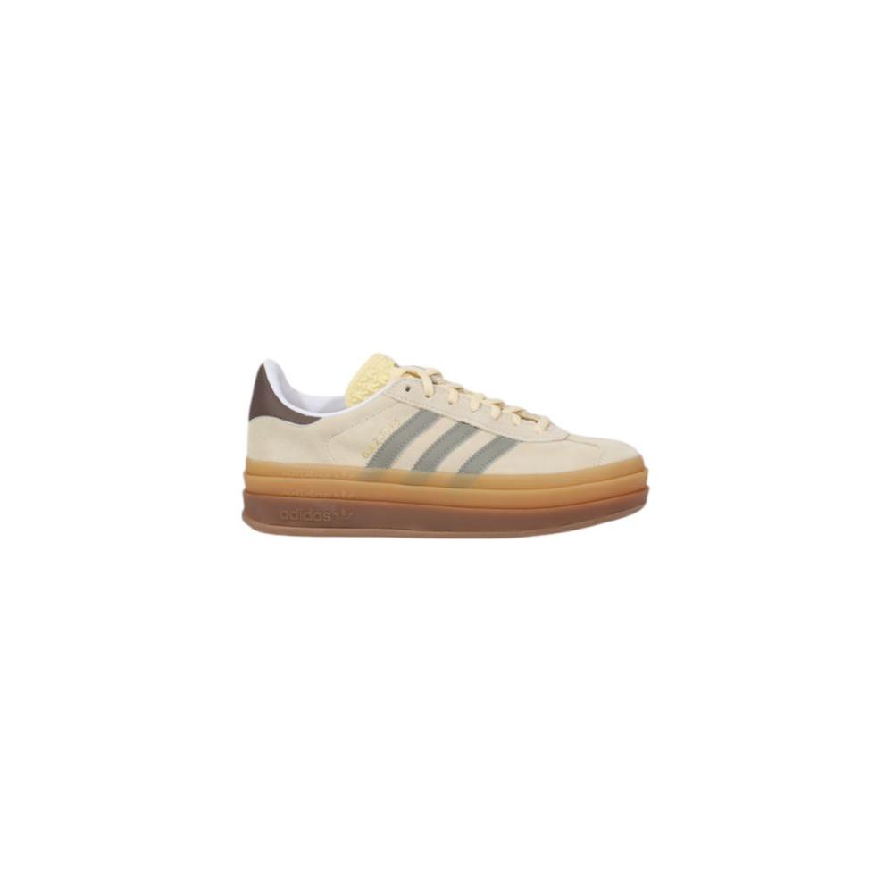 Side view of Adidas Gazelle Bold W cream suede leather sneaker with thick sole and iconic design.
