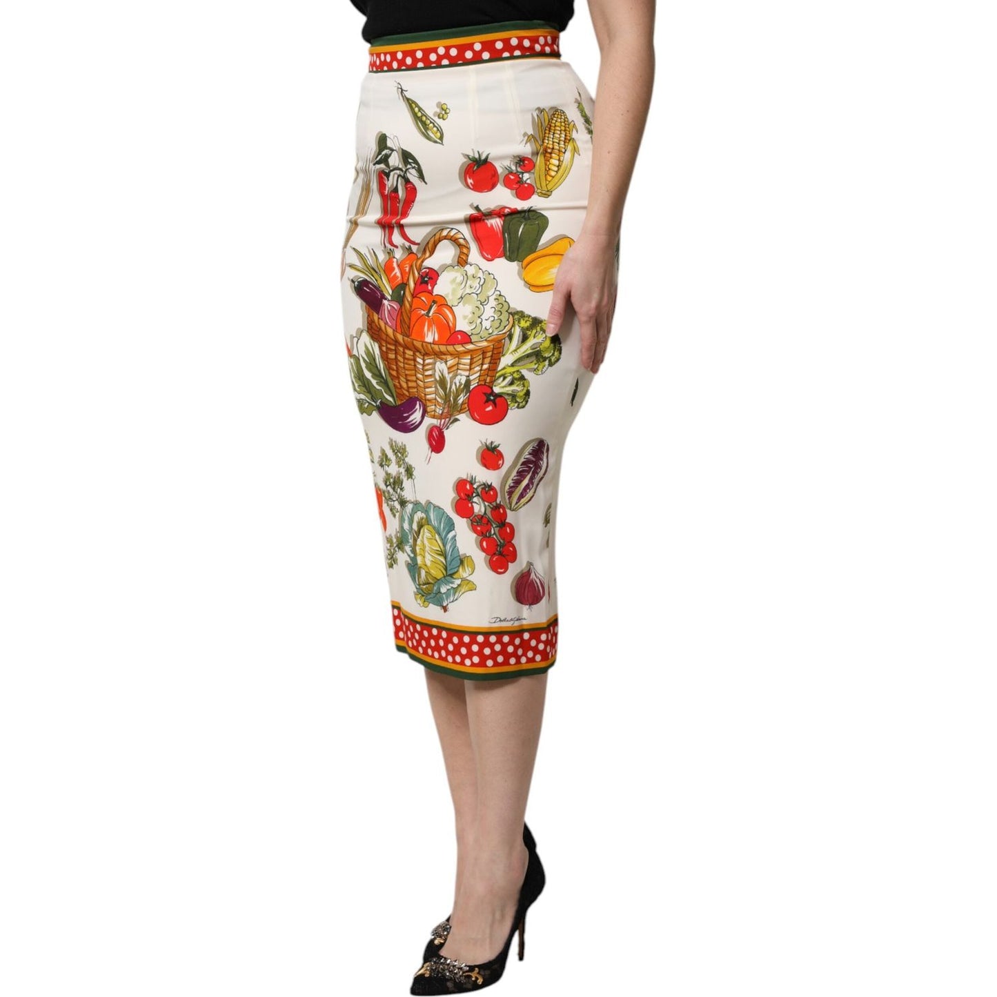 Dolce & Gabbana multicolor high waist pencil cut midi skirt with fruit and vegetable print, crafted from silk and elastane in Italy.