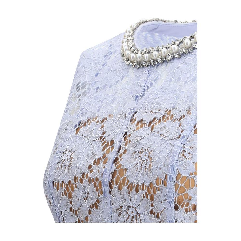 Close-up of Self-Portrait lace midi dress with floral pattern and pearl choker, showcasing elegant perforated design.