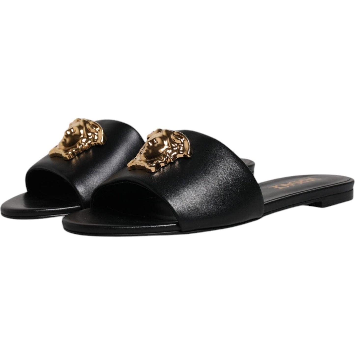 Versace black leather slides with gold logo plaque, open toe slip-ons for high comfort and quality, made in Italy.