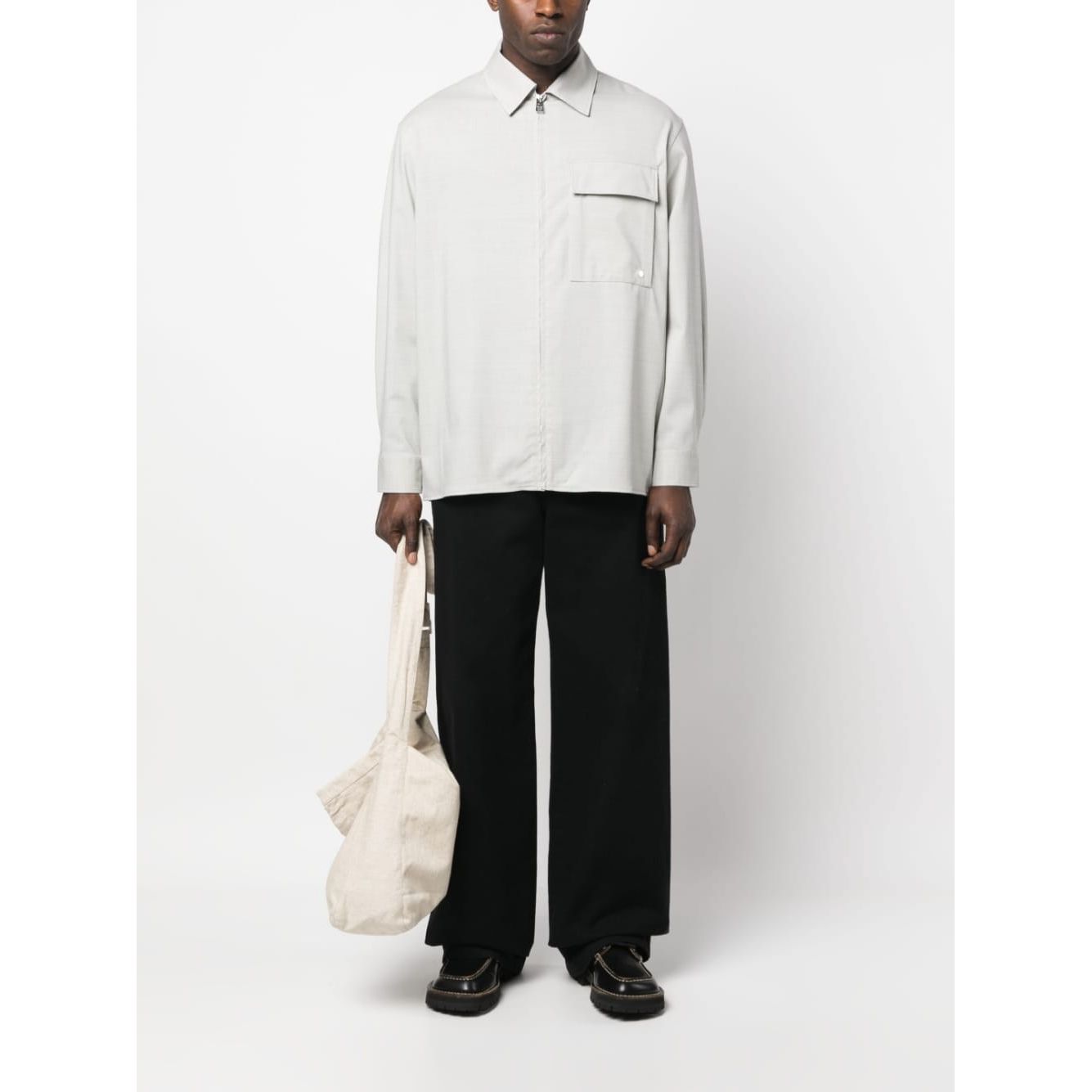 Front view with bag zipped and handles upright.