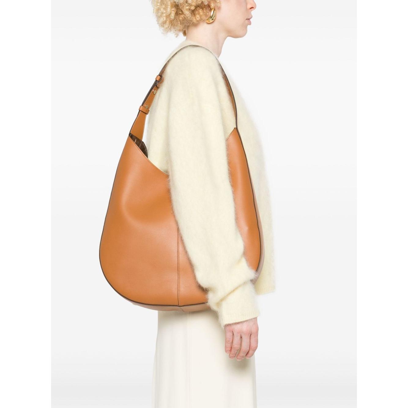 Front view with bag zipped and handles upright.