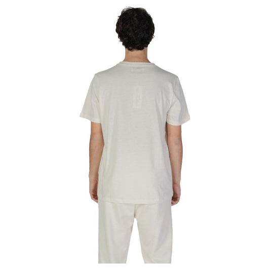 Man wearing an Underclub cream cotton t-shirt from the Fall/Winter collection, showcasing back view.