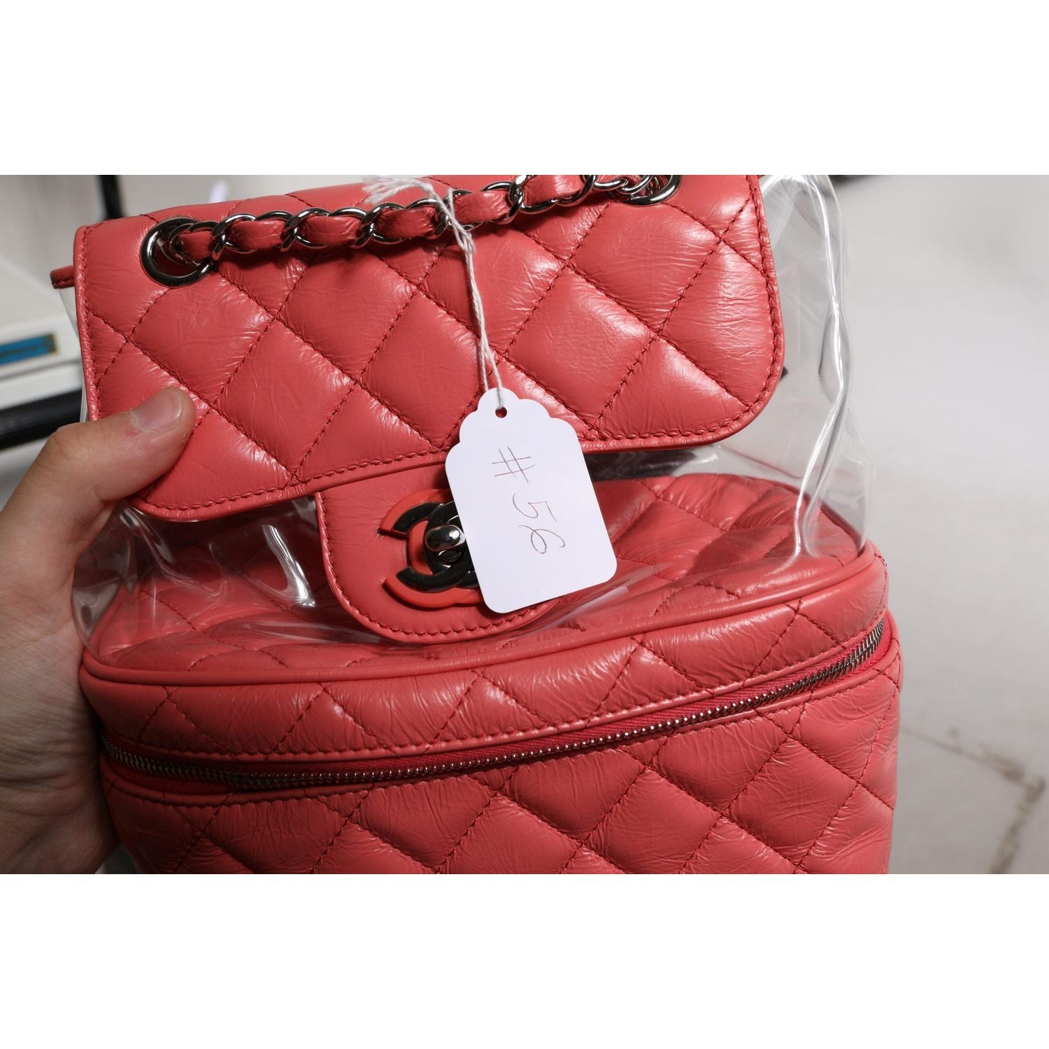 Front view with bag zipped and handles upright.
