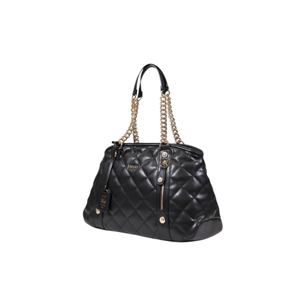 Front view with bag zipped and handles upright.