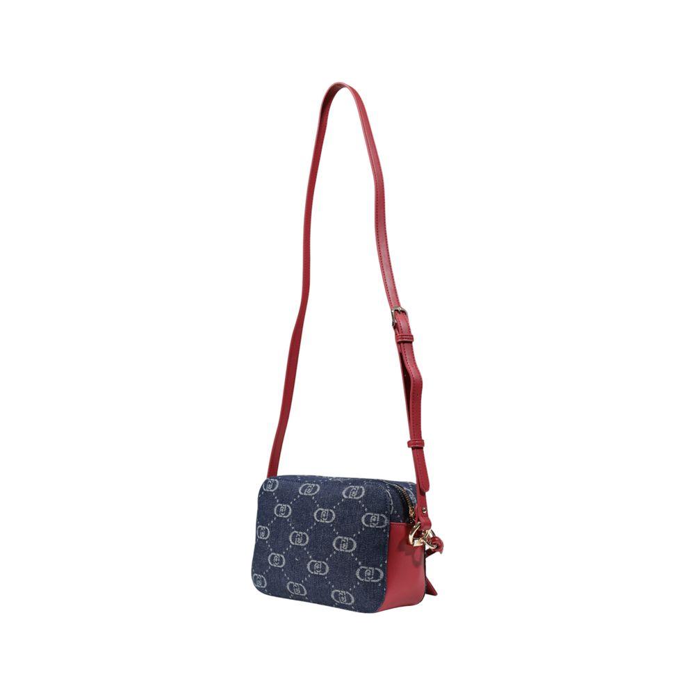 Front view with bag zipped and handles upright.